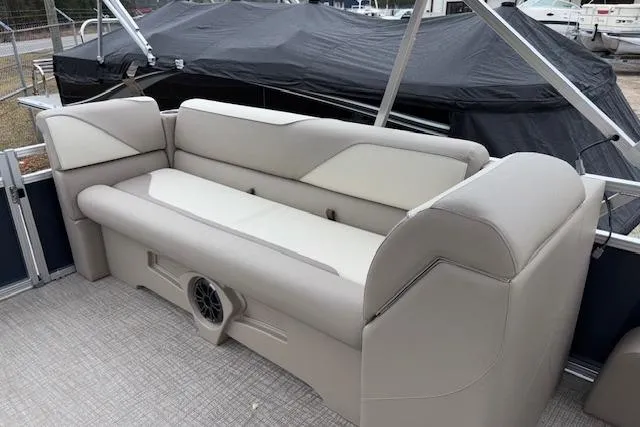 Slide: The Image of 2026 Tahoe Pontoon SPORT 2385 QUAD LOUNGE with beige seating and speaker system. - 11