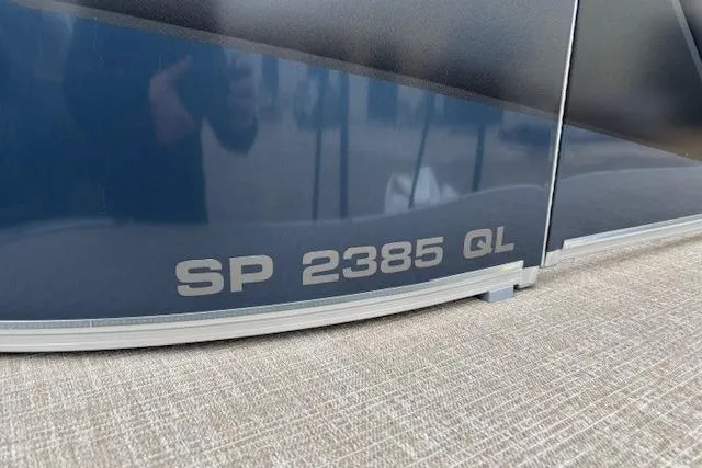 Slide: The Image of 2026 Tahoe Pontoon SPORT 2385 QUAD LOUNGE boat detail with model number. - 13