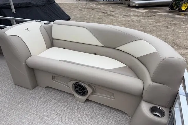Slide: The Image of 2026 Tahoe Pontoon SPORT 2385 QUAD LOUNGE with beige seating and built-in speaker. - 5