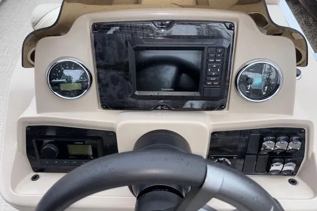 Slide: The Image of Dashboard of 2026 Tahoe Pontoon SPORT 2385 QUAD LOUNGE with steering wheel and control panel. - 9