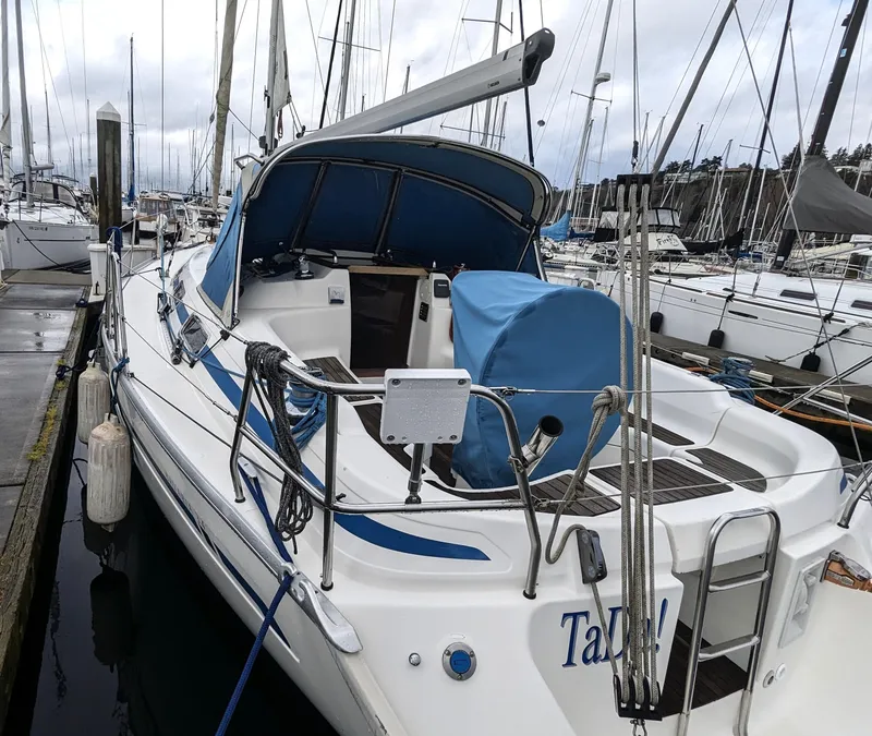 Slide: The Image of 2001 Bavaria 34 sailboat docked in marina. - 10