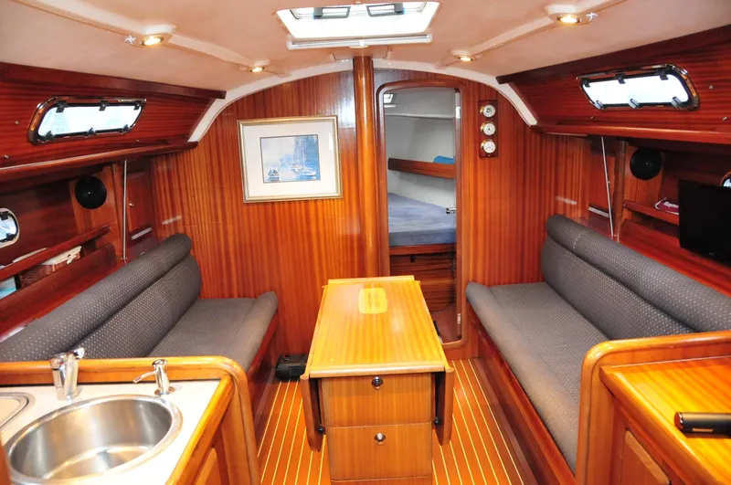 Slide: The Image of Interior of a 2001 Bavaria 34 yacht with wooden furnishings. - 14