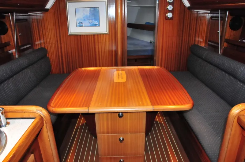 Slide: The Image of Interior of a 2001 Bavaria 34 yacht with wooden table. - 15