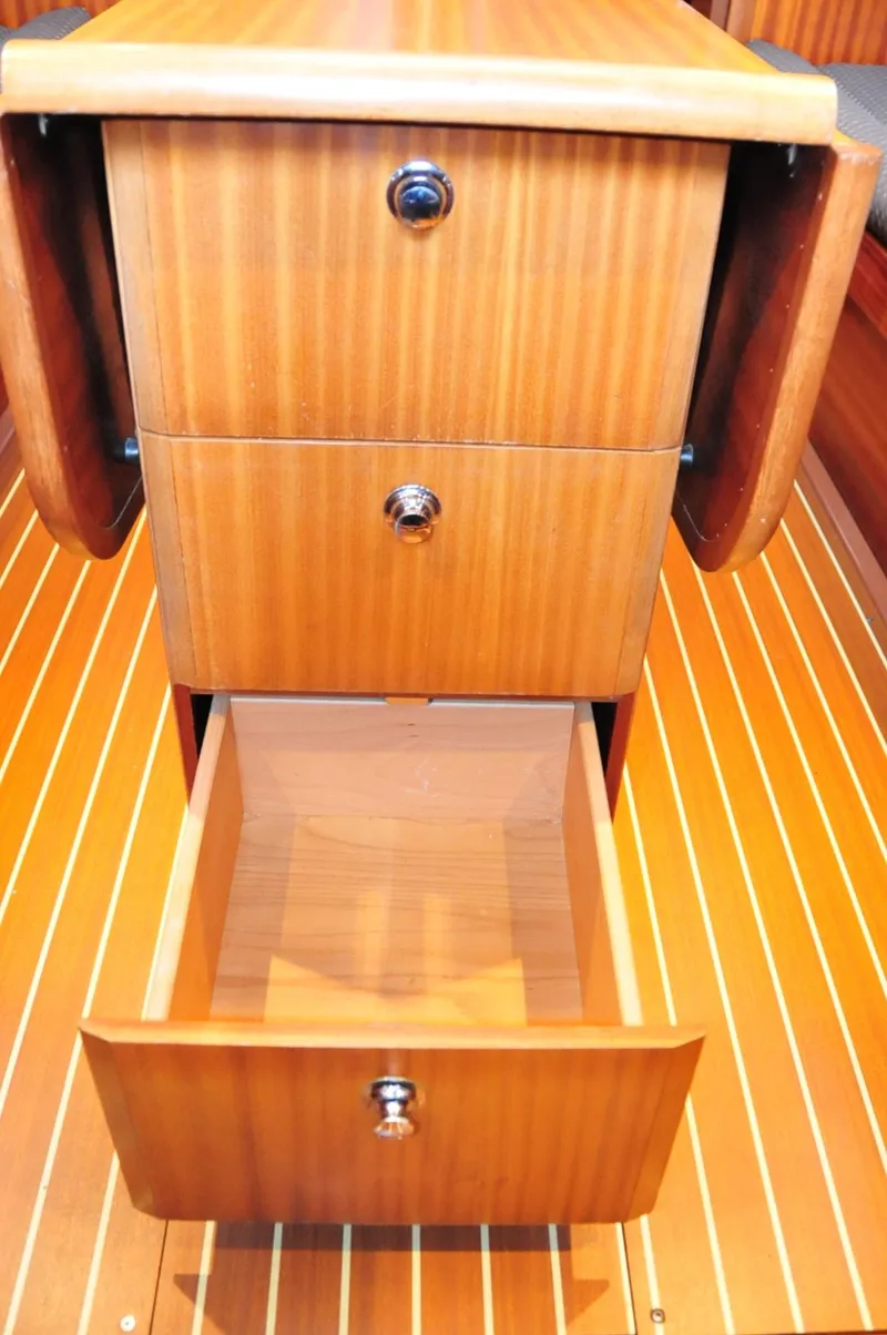 Slide: The Image of Wooden drawers inside a 2001 Bavaria 34 yacht. - 32