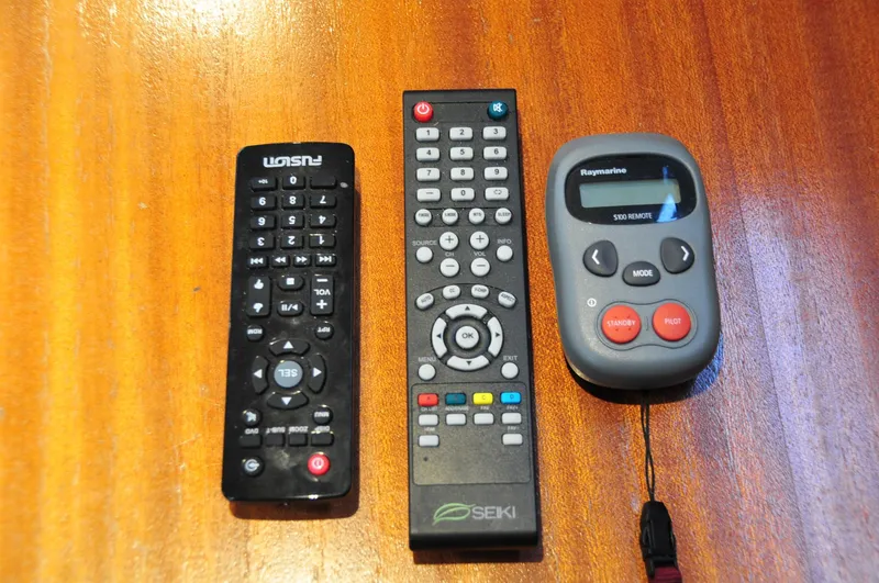 Slide: The Image of Three remote controls on a wooden table, Bavaria 34, 2001. - 43