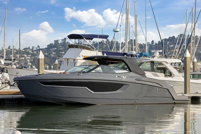 Slide: The Image of 2022 Cruisers Yachts 38 GLS South Beach IO docked in a marina. - 7