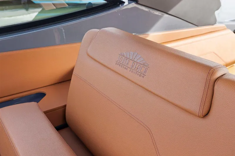 Slide: The Image of 2022 Cruisers Yachts 38 GLS South Beach IO, tan leather seating detail. - 20