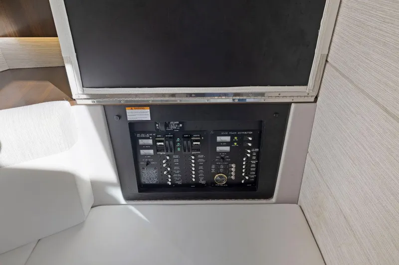Slide: The Image of Control panel inside 2022 Cruisers Yachts 38 GLS South Beach IO, featuring switches and indicators. - 37