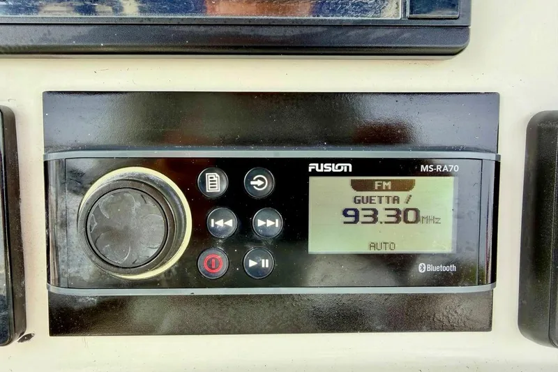 Slide: The Image of Fusion MS-RA70 radio display on 2016 NauticStar 28 XS, tuned to 93.30 MHz FM. - 26