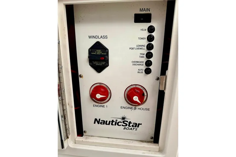 Slide: The Image of Control panel of a 2016 NauticStar 28 XS boat with labeled switches and dials. - 40