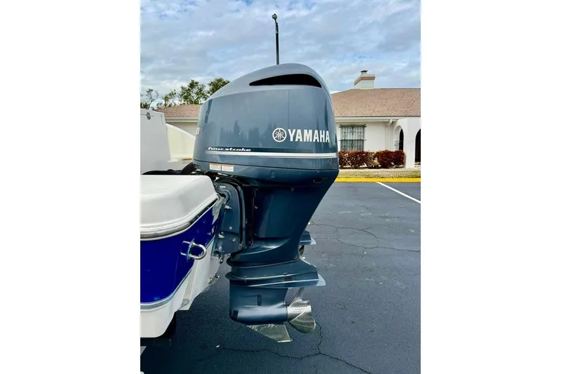 Slide: The Image of Yamaha outboard motor on 2016 NauticStar 28 XS boat, parked in residential area. - 43