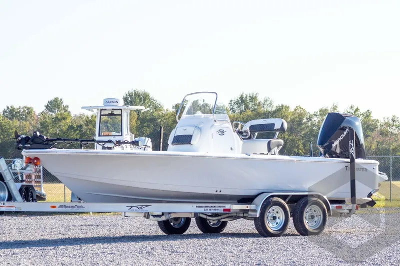 The Image of 2026 Tidewater 2110 Bay Max boat on trailer, featuring Garmin equipment and Mercury engine. - 1