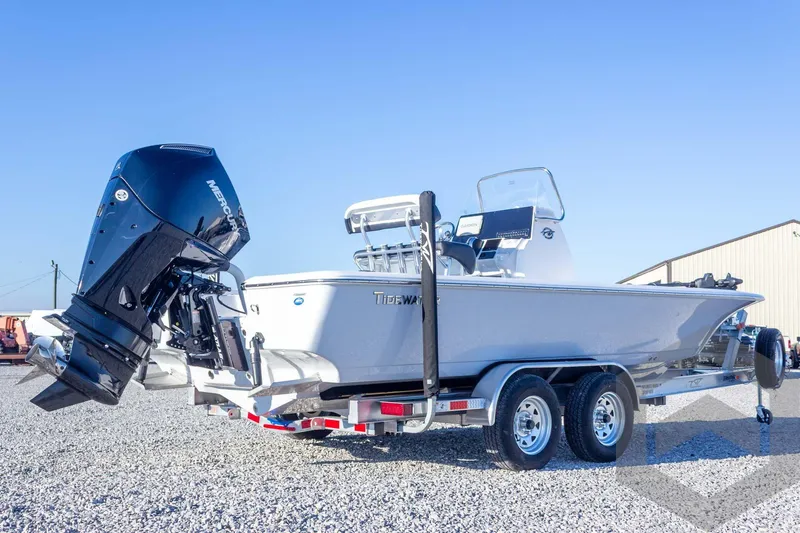 Slide: The Image of 2026 Tidewater 2110 Bay Max boat on trailer, featuring a powerful Mercury outboard engine. - 20