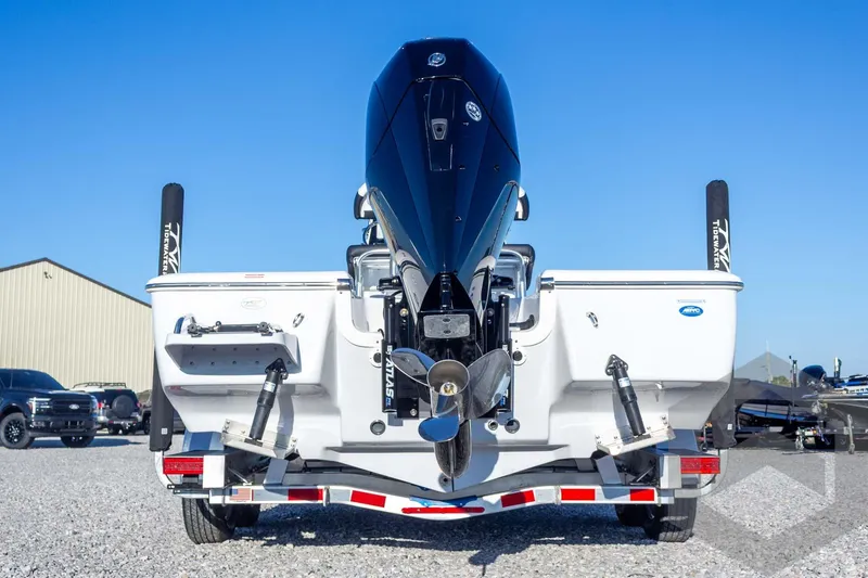 Slide: The Image of 2026 Tidewater 2110 Bay Max boat on trailer, rear view, clear sky background. - 21