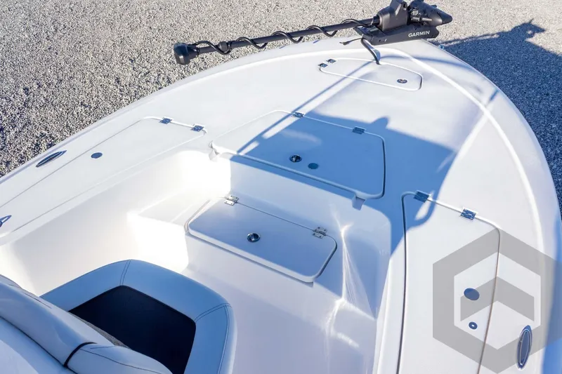 Slide: The Image of 2026 Tidewater 2110 Bay Max boat deck with storage compartments and Garmin equipment. - 24
