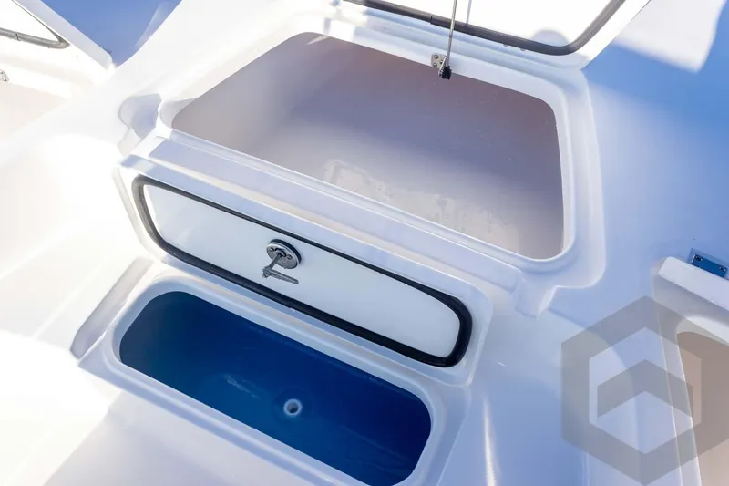Slide: The Image of 2026 Tidewater 2110 Bay Max boat storage compartments, open and spacious design. - 26