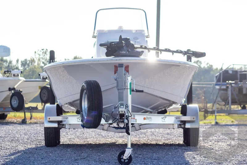 Slide: The Image of 2026 Tidewater 2110 Bay Max boat on trailer, parked outdoors in sunlight. - 3