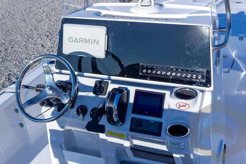 Slide: The Image of 2026 Tidewater 2110 Bay Max boat console with Garmin navigation system and controls. - 32