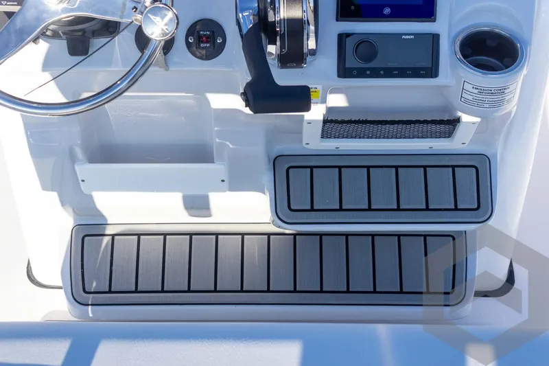 Slide: The Image of 2026 Tidewater 2110 Bay Max boat console with steering wheel and controls. - 33