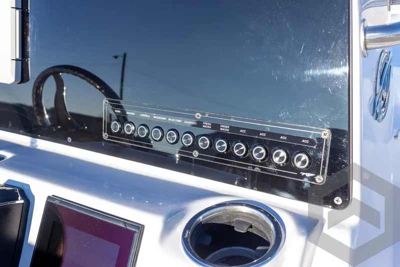 Slide: The Image of 2026 Tidewater 2110 Bay Max boat dashboard with control panel and steering wheel. - 35