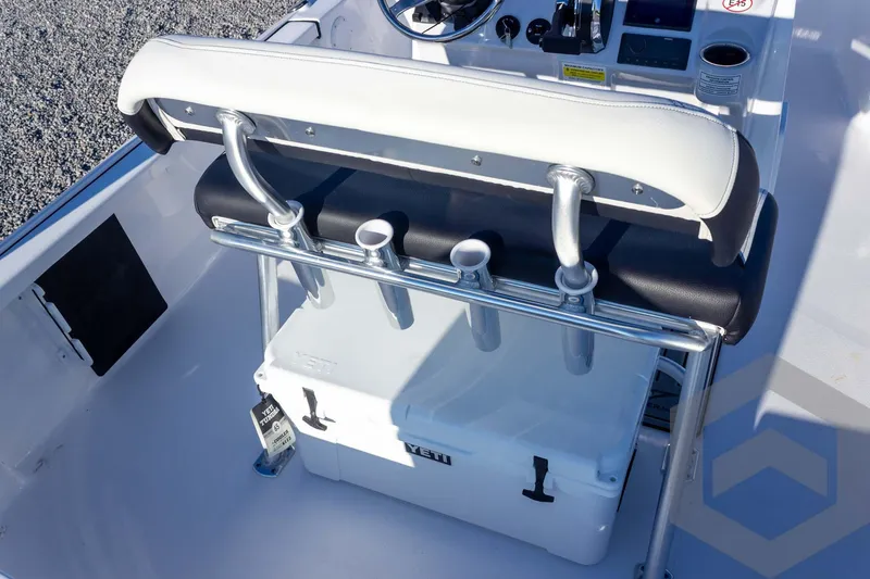 Slide: The Image of 2026 Tidewater 2110 Bay Max boat interior with seating and Yeti cooler. - 38