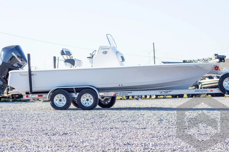 Slide: The Image of 2026 Tidewater 2110 Bay Max boat on a trailer, side view. - 7