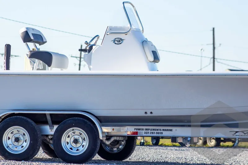 Slide: The Image of 2026 Tidewater 2110 Bay Max boat on trailer, side view, outdoors. - 9