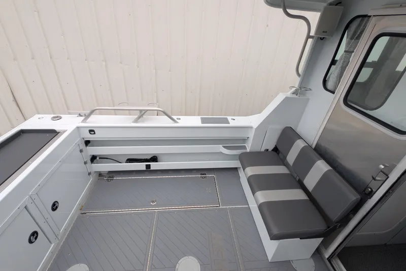Slide: The Image of 2022 Hewscraft Pacific Explorer interior with seating and storage compartments. - 18