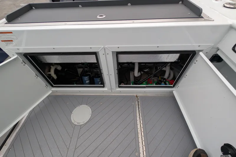 Slide: The Image of 2022 Hewscraft Pacific Explorer engine compartment with open access panels. - 20