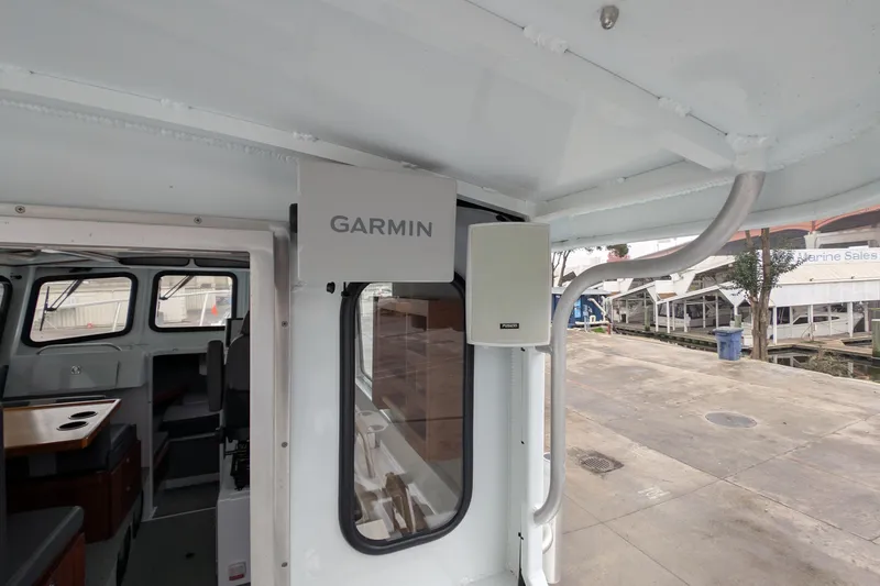 Slide: The Image of Interior view of 2022 Hewscraft Pacific Explorer with Garmin equipment. - 23