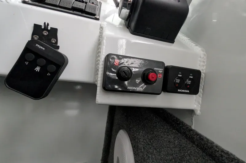 Slide: The Image of Control panel of a 2022 Hewscraft Pacific Explorer boat with Honda components. - 37