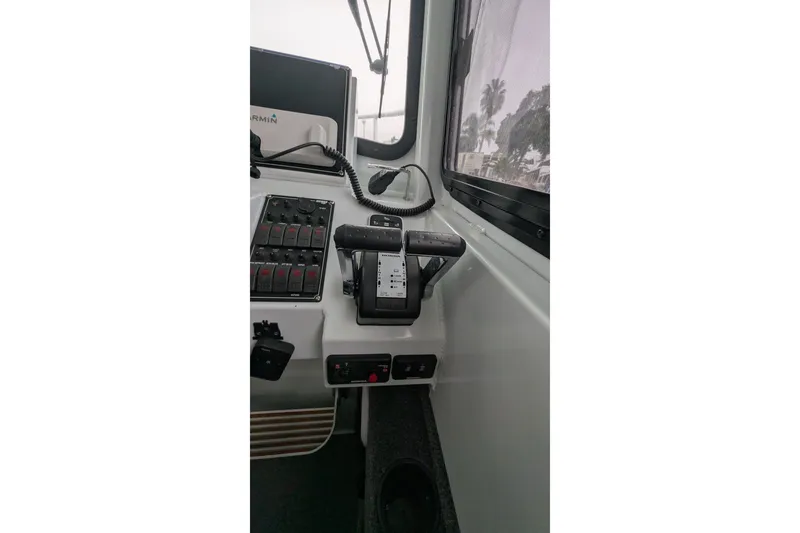 Slide: The Image of Control panel of 2022 Hewscraft Pacific Explorer boat with Garmin equipment. - 39