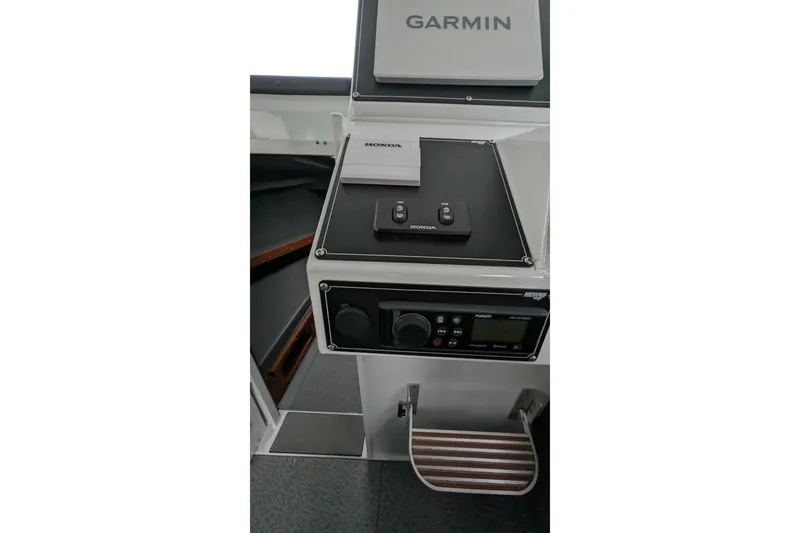 Slide: The Image of Control panel of 2022 Hewscraft Pacific Explorer with Garmin and Honda equipment. - 41