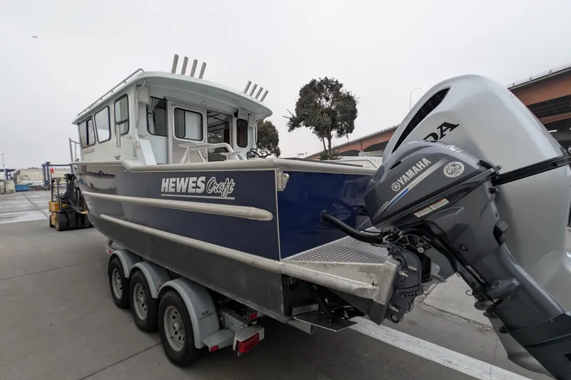 Slide: The Image of 2022 Hewscraft Pacific Explorer boat with Yamaha outboard motor on trailer. - 5
