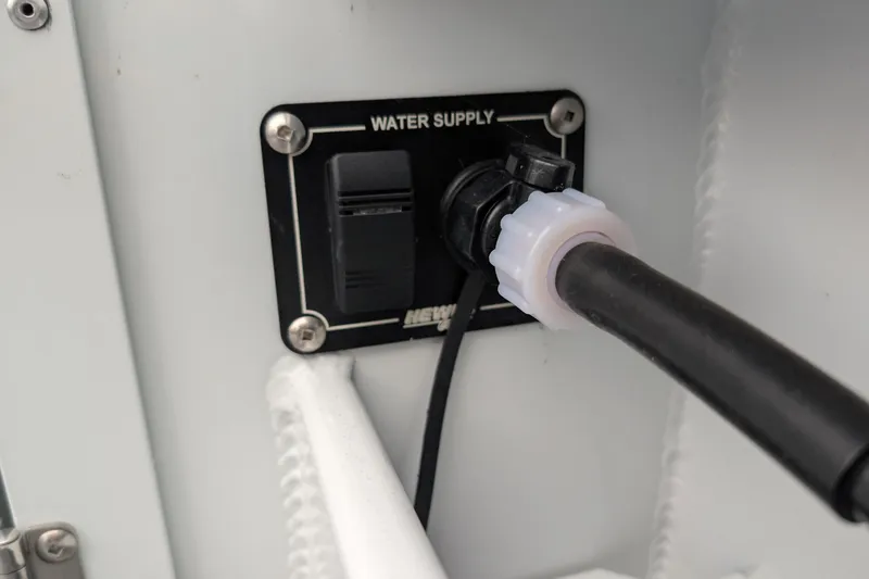 Slide: The Image of Water supply connection on 2022 Hewscraft Pacific Explorer boat. - 52