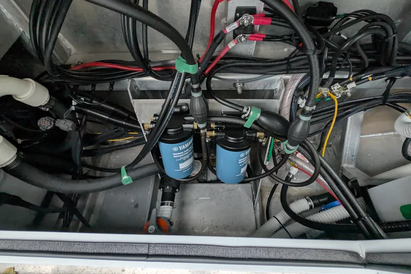 Slide: The Image of Engine compartment of a 2022 Hewscraft Pacific Explorer with Yamaha filters and wiring. - 54