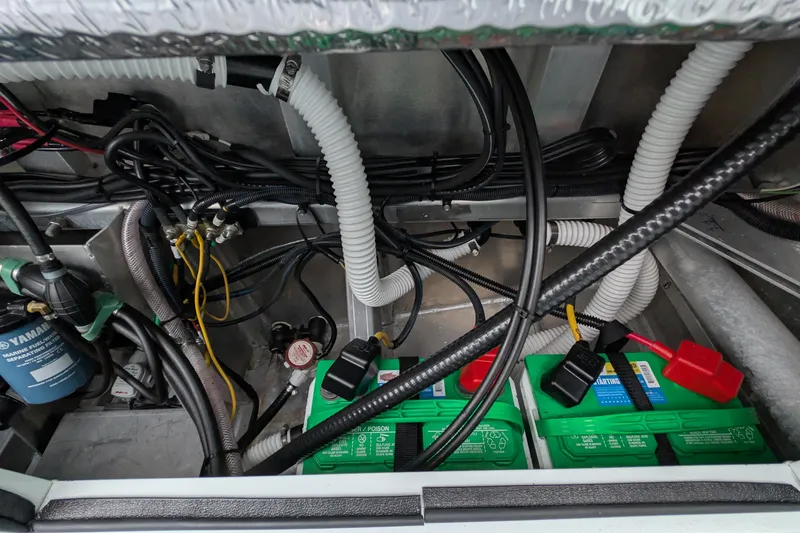 Slide: The Image of 2022 Hewscraft Pacific Explorer engine compartment with batteries and wiring. - 55