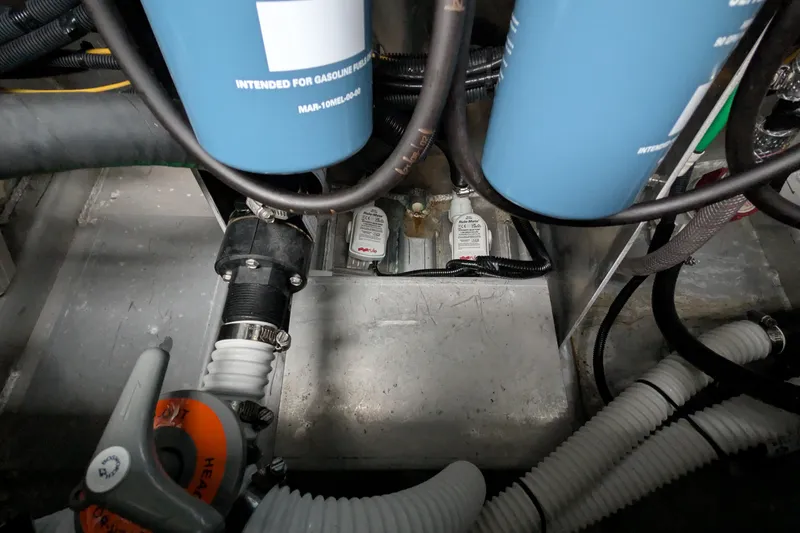 Slide: The Image of 2022 Hewscraft Pacific Explorer engine compartment with fuel filters and hoses. - 56