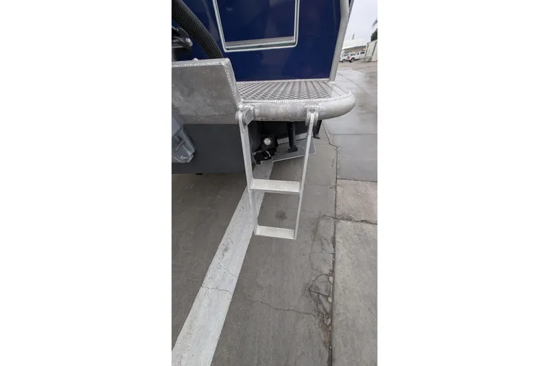 Slide: The Image of 2022 Hewscraft Pacific Explorer boat ladder on concrete surface. - 60