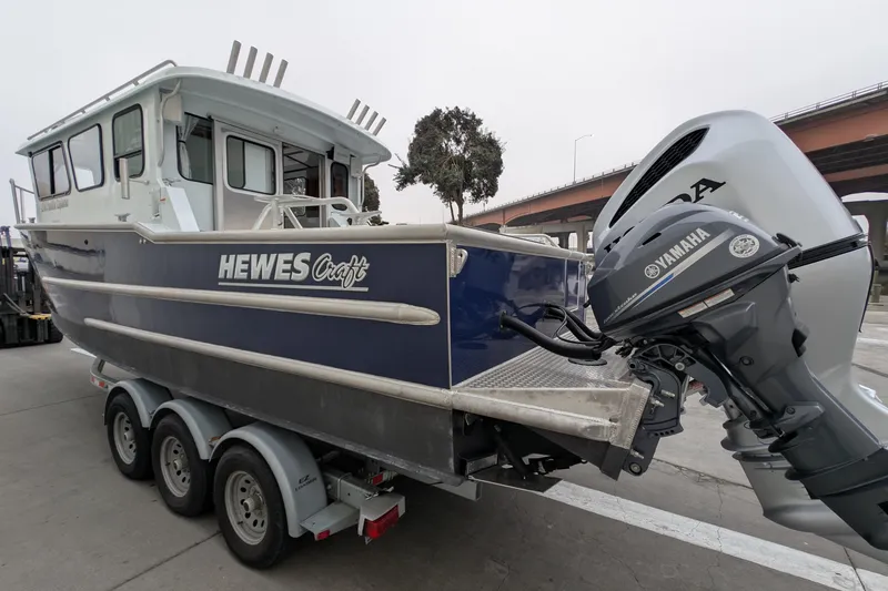 Slide: The Image of 2022 Hewscraft Pacific Explorer boat with Yamaha outboard motor on trailer. - 7