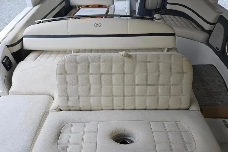 Slide: The Image of 2020 Cobalt R7 Surf boat interior with beige cushioned seating and cup holders. - 10