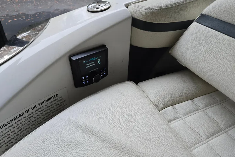 Slide: The Image of 2020 Cobalt R7 Surf boat interior with Bluetooth stereo system and beige leather seating. - 11