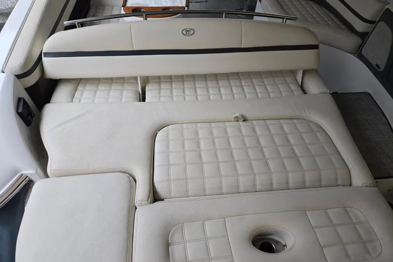 Slide: The Image of 2020 Cobalt R7 Surf boat interior with beige quilted seating. - 17