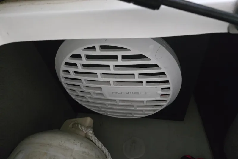 Slide: The Image of White Roswell speaker in a 2020 Cobalt R7 Surf boat interior. - 22