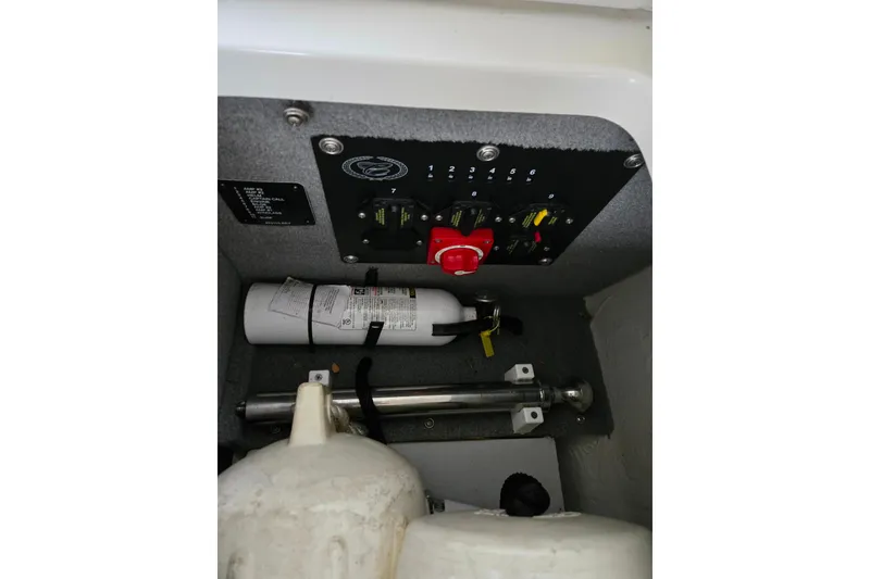 Slide: The Image of 2020 Cobalt R7 Surf boat interior control panel with fire extinguisher. - 25
