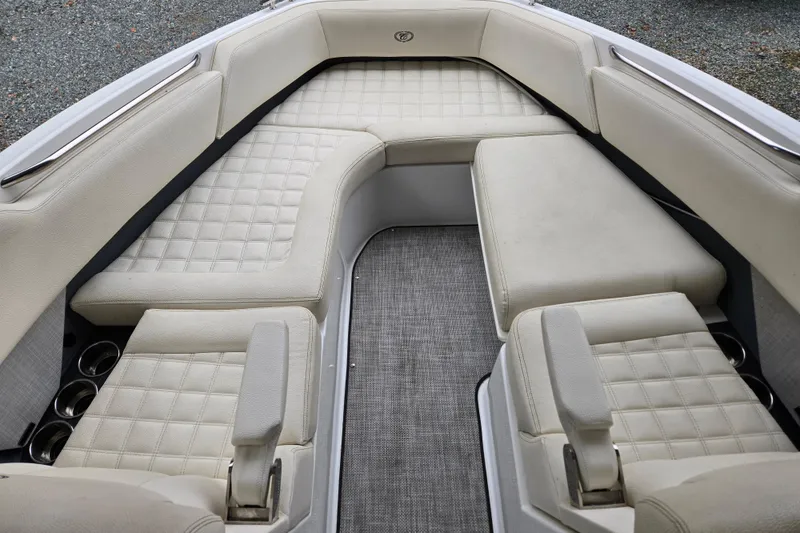 Slide: The Image of 2020 Cobalt R7 Surf boat interior with cushioned seating and cup holders. - 26