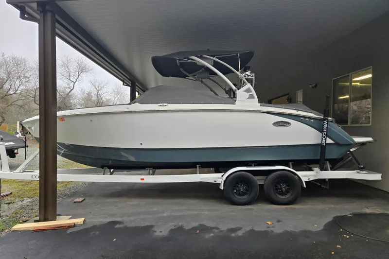 Slide: The Image of 2020 Cobalt R7 Surf boat on trailer under shelter. - 29