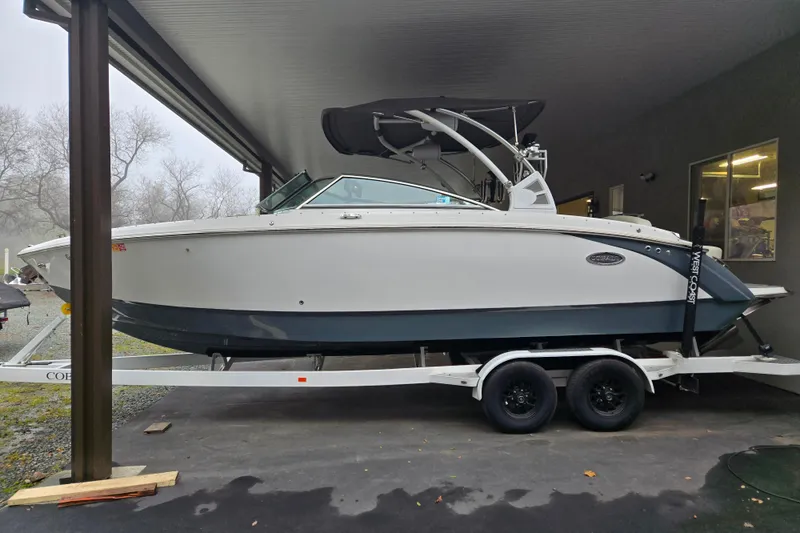 Slide: The Image of 2020 Cobalt R7 Surf boat on trailer under shelter, side view. - 4