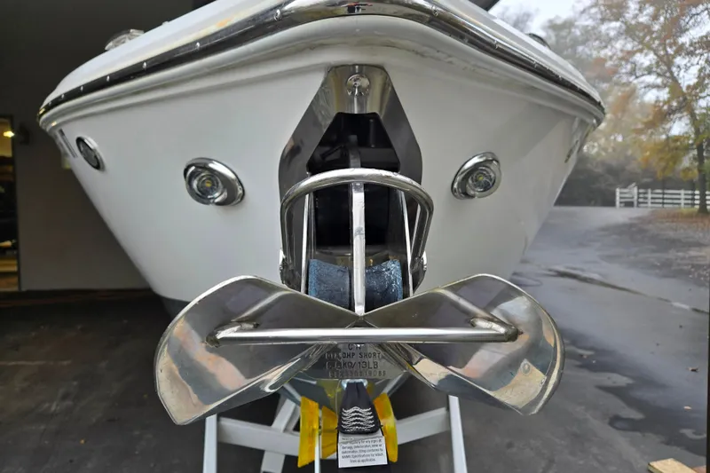 Slide: The Image of 2020 Cobalt R7 Surf boat with stainless steel anchor, parked outdoors. - 7