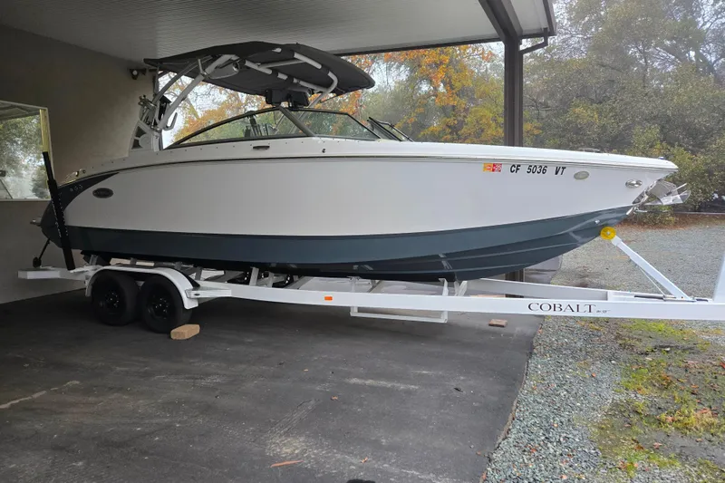Slide: The Image of 2020 Cobalt R7 Surf boat on trailer under shelter, side view. - 8